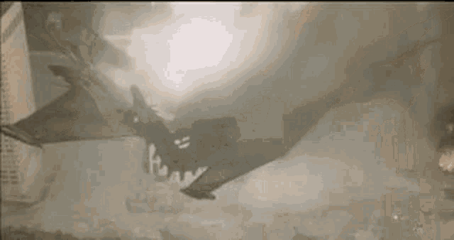 a helicopter is flying through a cloud of smoke in the air .