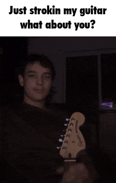 a young man is holding a guitar in a dark room and the caption says just strokin my guitar what about you