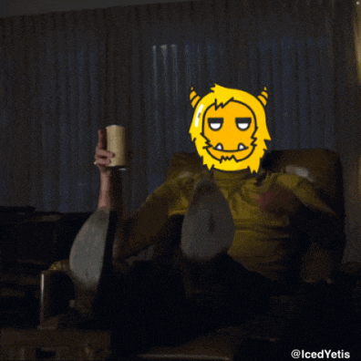 a man in a yellow shirt is sitting in a chair holding a cup of coffee