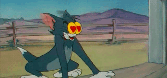 a cartoon of tom and jerry with hearts on his eyes