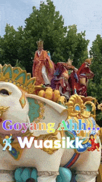 a picture of a parade with the words goyang ahh wuasikk written on it