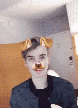 a young man wearing a dog face mask