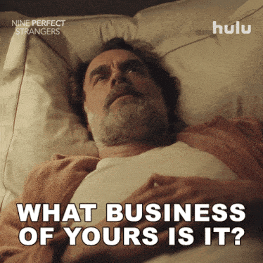 a man is laying in bed with the words what business of yours is it