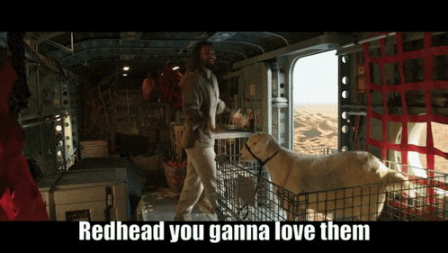 a man standing next to a goat in a cage with the words " redhead you gonna love them " on the bottom