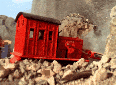 a red train with the word thumper written on it