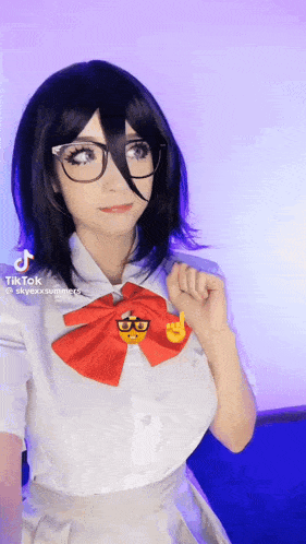a girl in a school uniform with glasses and a red bow tie
