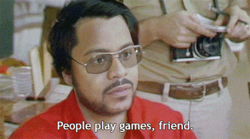 a man with glasses and a red shirt says " people play games friend "
