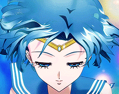 a close up of a girl with blue hair and a gold tiara