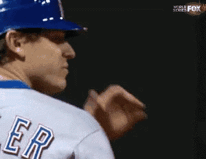 a baseball player wearing a blue helmet and a white jersey with the word er on it