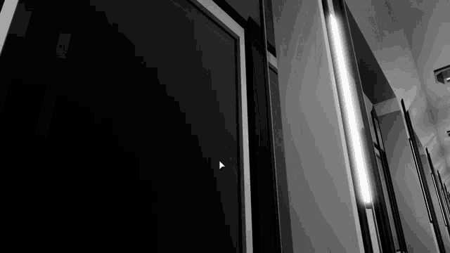 a black door with an arrow pointing to it