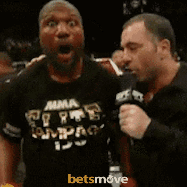 a man in a mma shirt is being interviewed