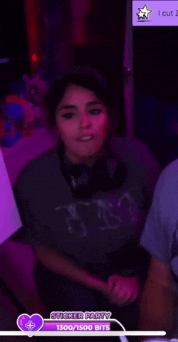 a woman in a sticker party shirt is holding a container