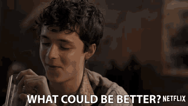 a man with curly hair is smiling with the words what could be better netflix below him