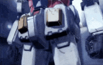 a close up of a robot 's legs with a gold cube on the back .