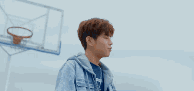 a young man wearing a blue shirt that says ' l' amour '