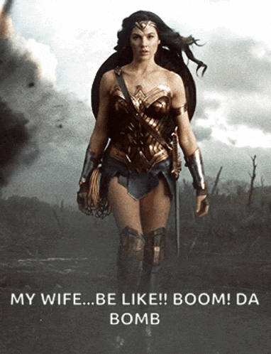 a woman in a wonder woman costume is standing in a field