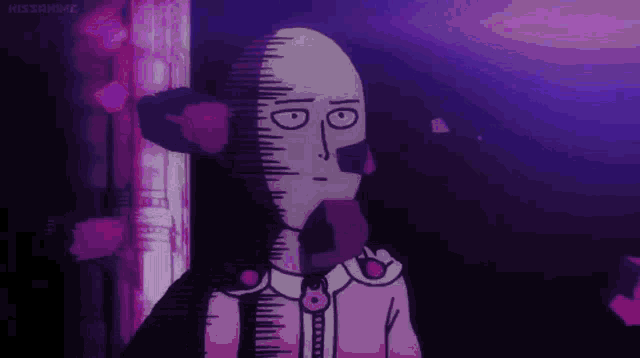 a bald man is standing in a dark room with purple flowers behind him .