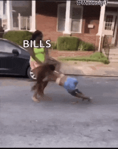 a woman is pushing a child down the street with the words bills written on the ground