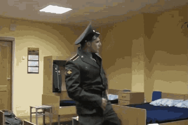 a man in a military uniform is standing in a bedroom
