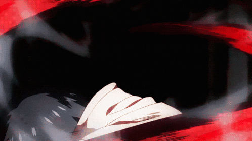 a person 's face is visible in a dark room with red smoke coming out of it