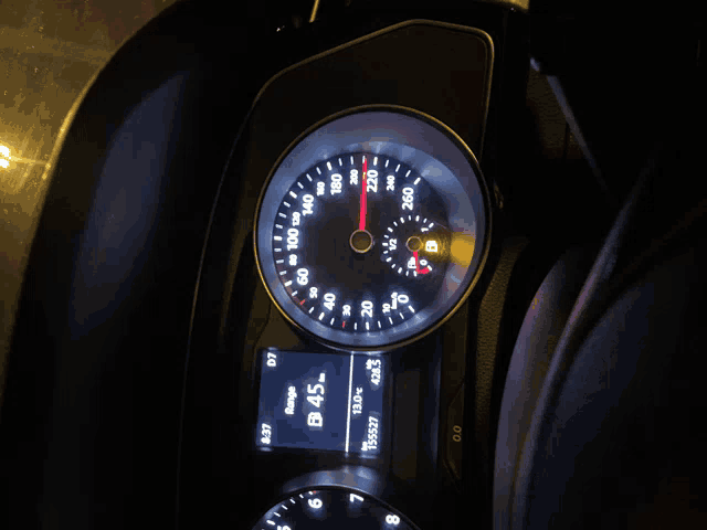 a close up of a car 's dashboard at night with a display that says b 45