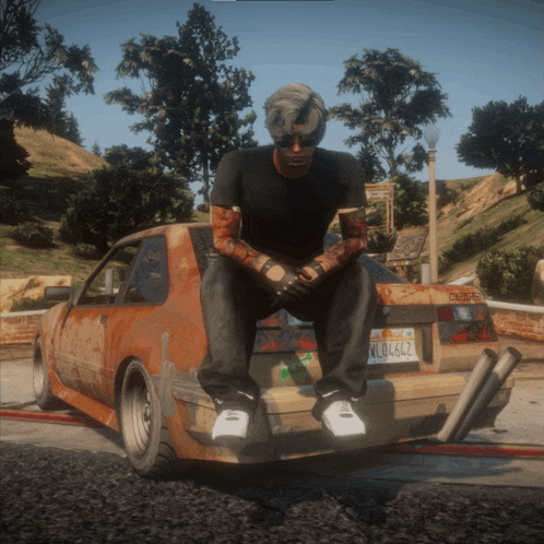 a man is sitting on the back of a car with a license plate that says wl06422