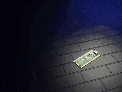 a motherboard is laying on a brick floor .