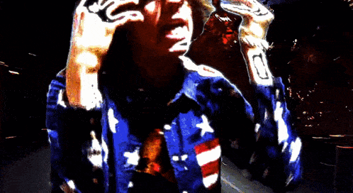 a man wearing a blue shirt with stars and stripes