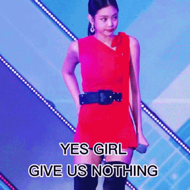 a girl in a red dress is holding a microphone and says yes girl give us nothing