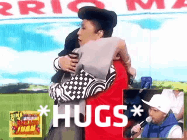two people hugging each other with the words * hugs * in the corner