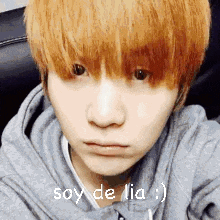 a close up of a person 's face with the words soy de lia written on it