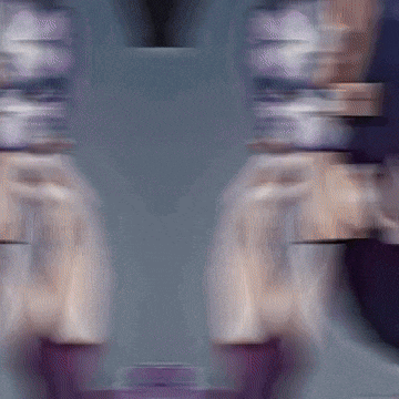 a blurry picture of a person 's face with purple lipstick