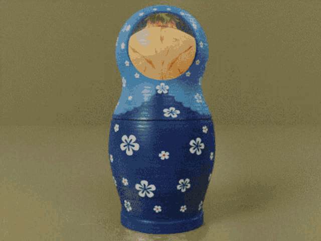 three russian nesting dolls are lined up in a row with flowers on them