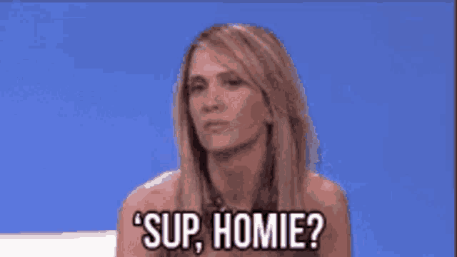 a woman is sitting on a couch and saying ' sup homie '