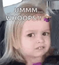 a little girl is making a funny face while sitting in a car with a purple flower in her hair .