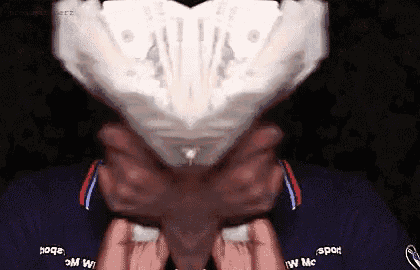 a person is holding a piece of paper in front of their face