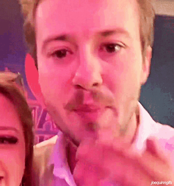 a close up of a man 's face with the words joequinngifs below