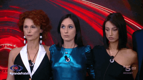 three women standing next to each other with the words grandefratelli on the bottom left