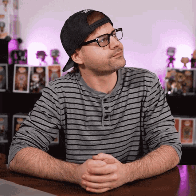 a man wearing glasses and a hat that says ny