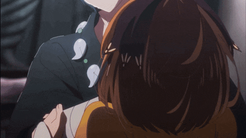 a blue haired anime character with a brown haired girl behind him