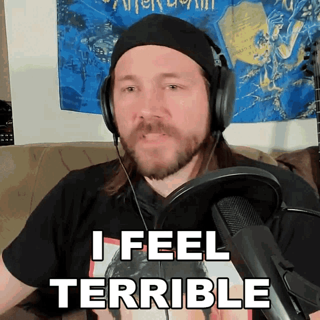 a man wearing headphones and a hat says i feel terrible