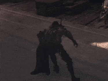 a shadow of a person is cast on the ground in a video game
