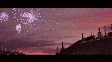 fireworks are displayed in the sky above a city