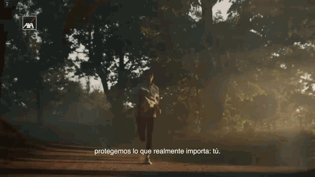 an advertisement for axa shows a woman running through a forest