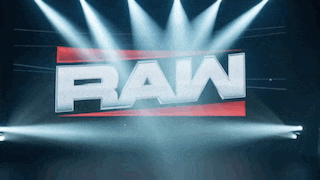 a raw logo is lit up in a dark room