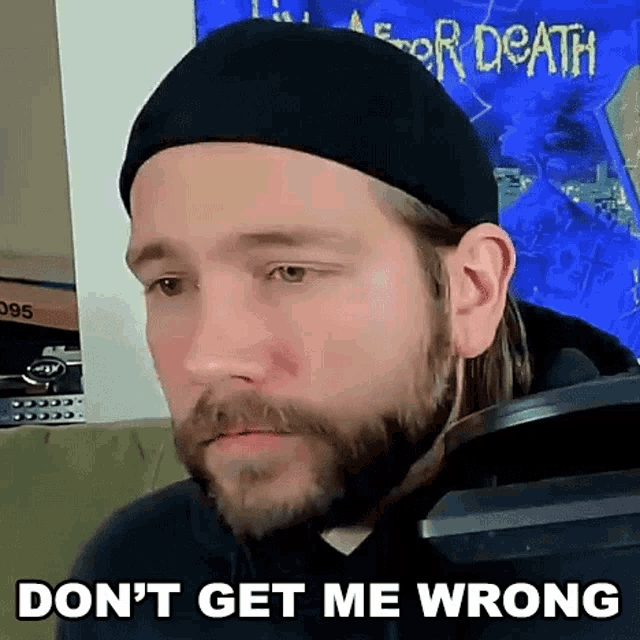 a man with a beard is wearing a hat and a hoodie and says `` do n't get me wrong '' .