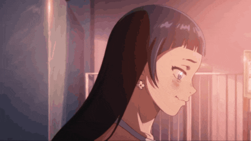 a close up of a girl 's face with a flower in her ear