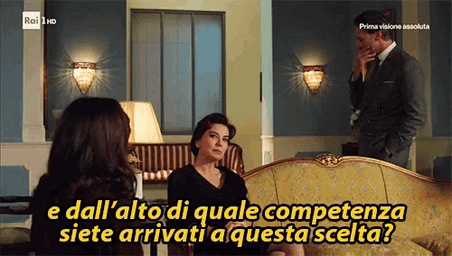 a tv screen shows a woman sitting on a couch and the words " e dall alto di quale competenza "