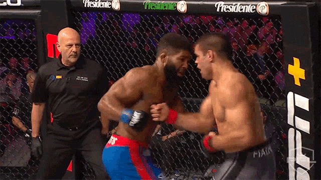 two men are fighting in a cage with a banner that says presidente in the background
