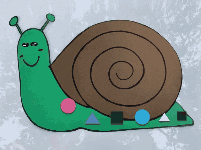 a green snail with a brown shell is surrounded by various shapes